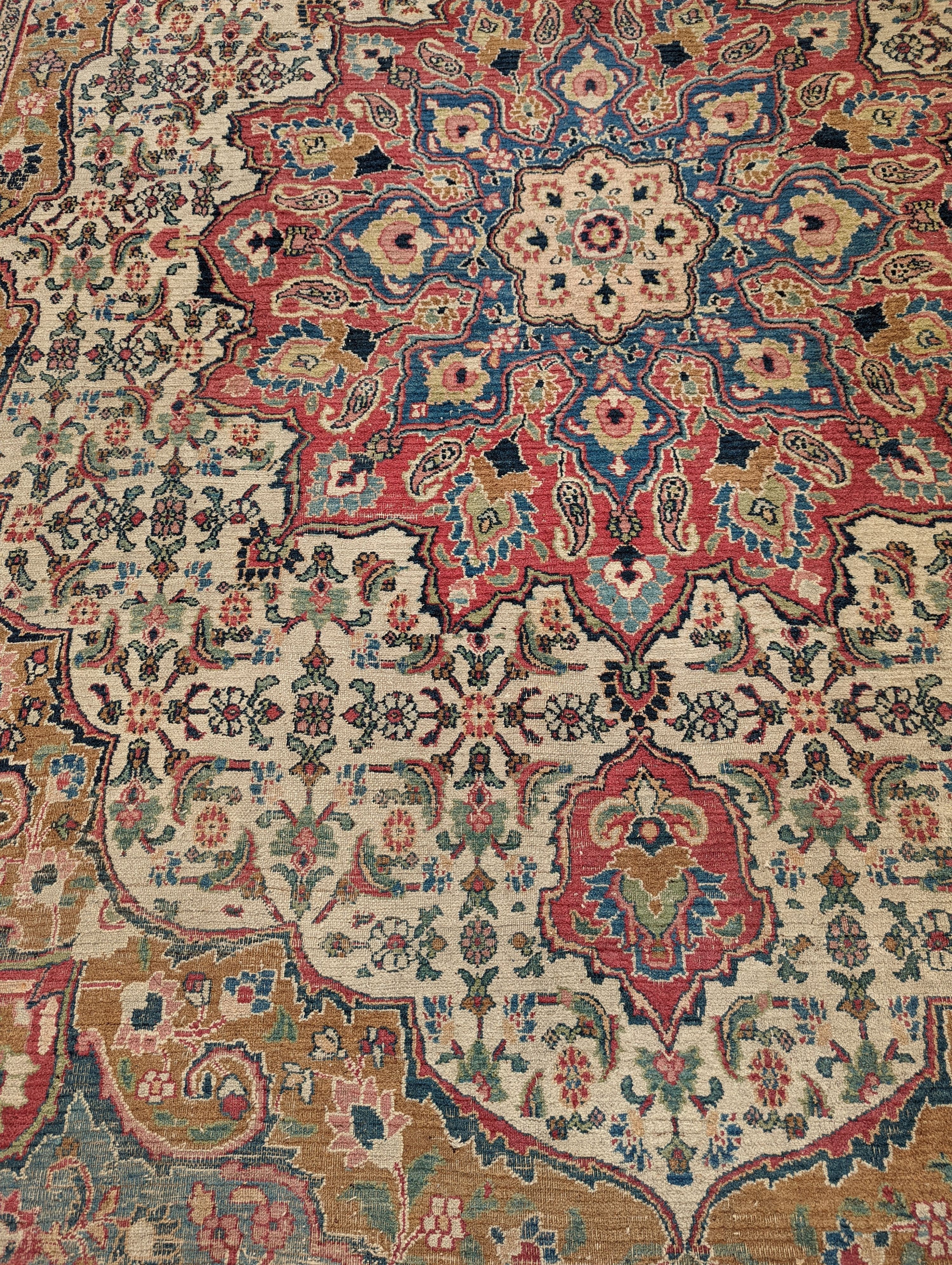 An Isfahan ivory ground carpet, 432 x 330cm